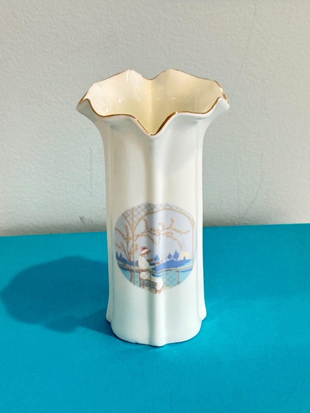 Vintage fluted bud vase Art Deco style woman sitting at lake 5" tall white blue
